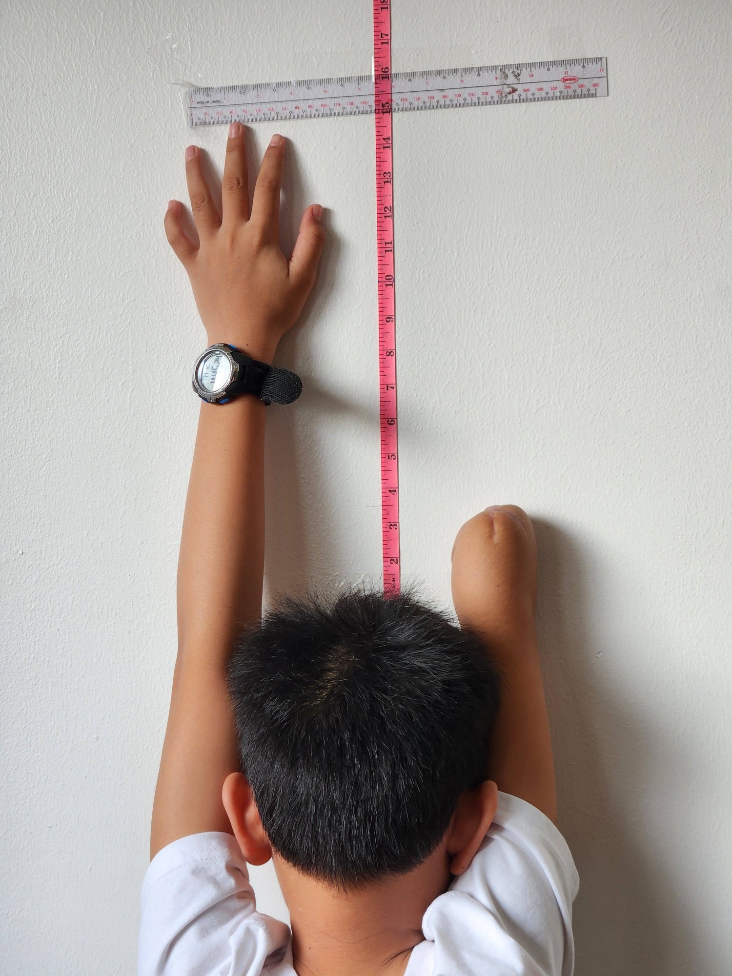 Arm tracing on paper with tape measure