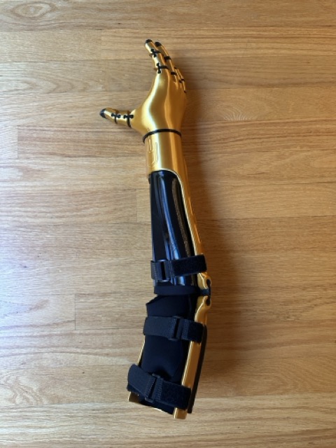 Kinetic Arm, three-quarter view on wood floor