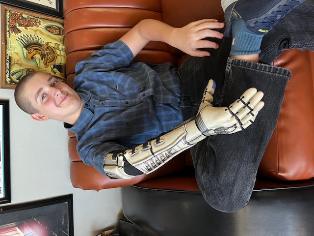 Mi. at the tattoo studio with his custom airbrushed Kinetic Arm