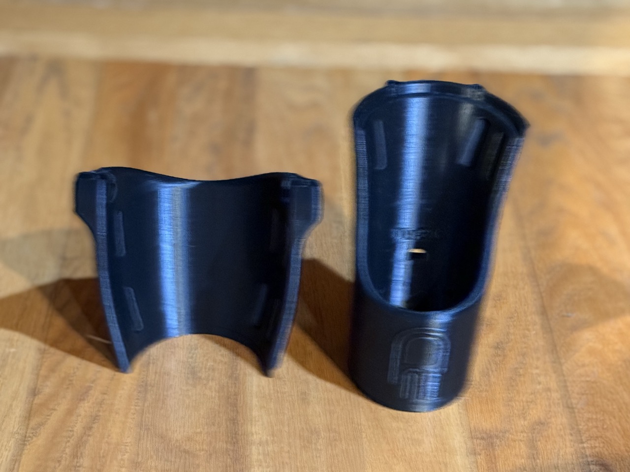 E.F.'s arm socket components: elbow cup and wrist cup side by side, 'E.F.' name visible on the piece