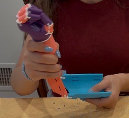 Assembly detail — stringing the wrist tension mechanism