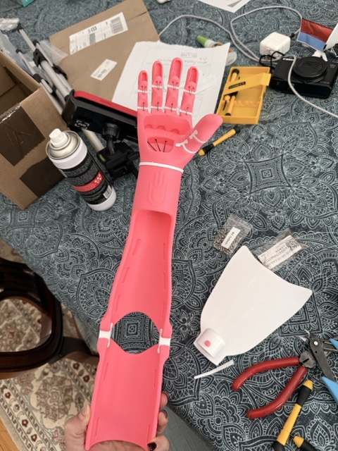 The finished pink Kinetic Arm fully assembled, shown from the front