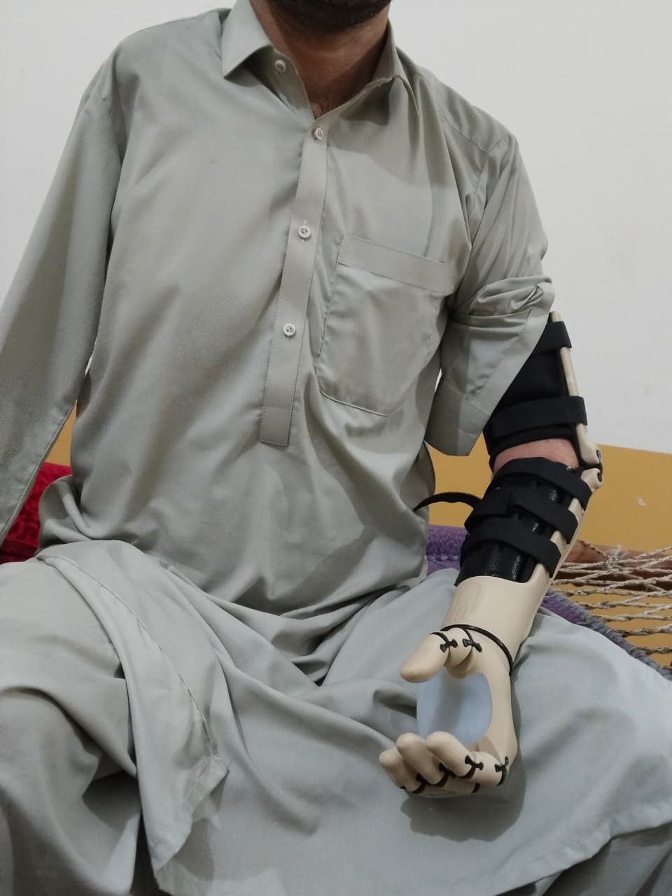 A.S. in Lower Dir, Pakistan, wearing his new skin-tone Kinetic Arm